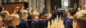 Children creating music using the WOOFYT organ at the Easter music workshop in St. Patrick’s Cathedral, exploring sound and technology.